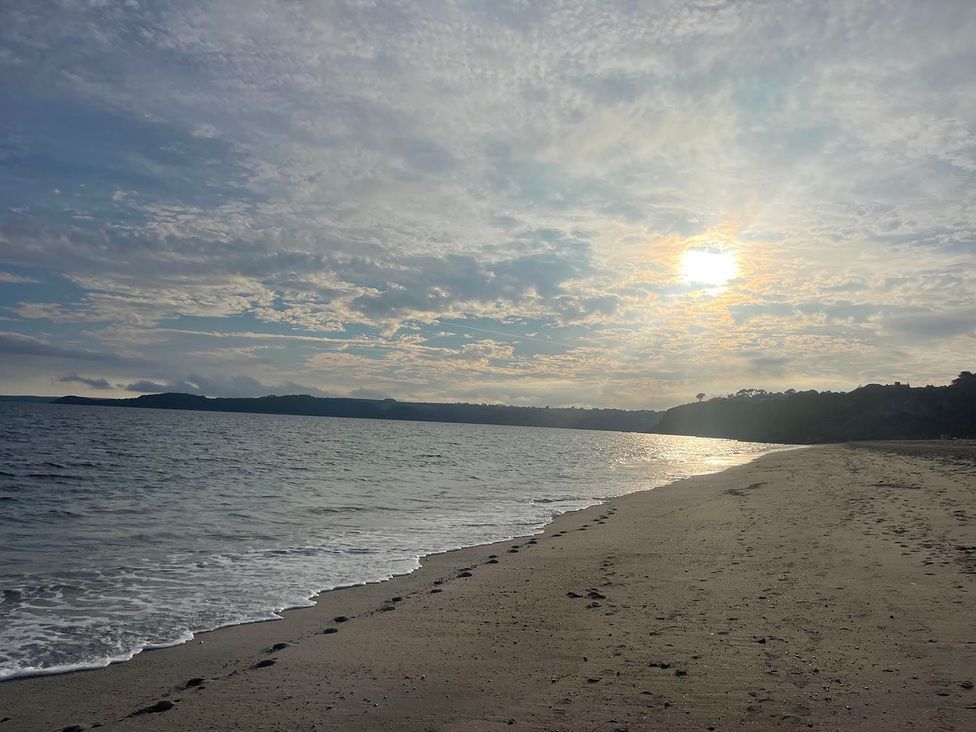 A beach with sand and ocean at Buzzards Lodge near Victoria