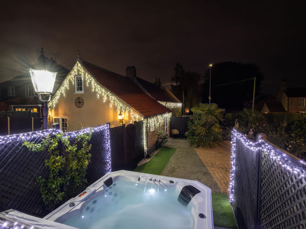A spa with lights in the garden at Rose Cottage in Kirkby-In-Ashfield