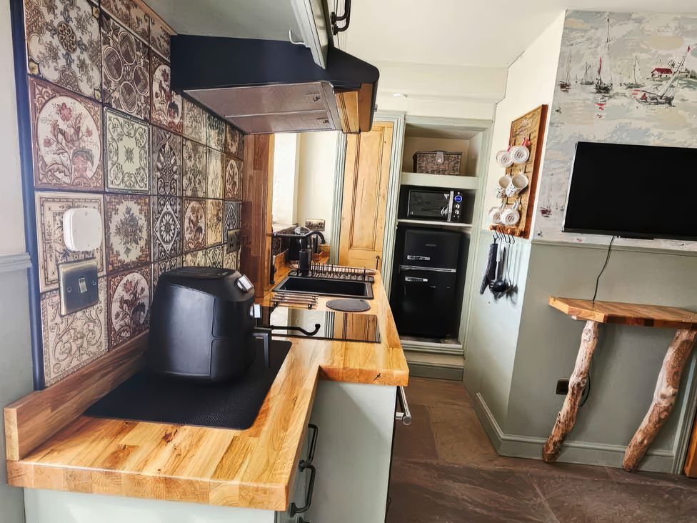 A kitchen with a coffee maker and stove at Seaglass in Bridlington