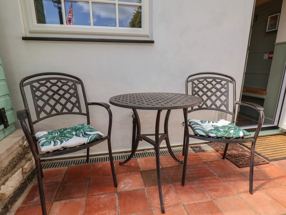 A table and chairs on an outdoor patio at Seaglass in Flamborough