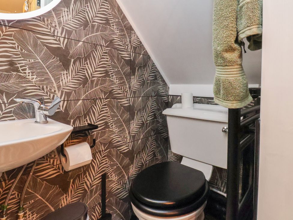 A bathroom with a sink and toilet at Seaglass in Flamborough
