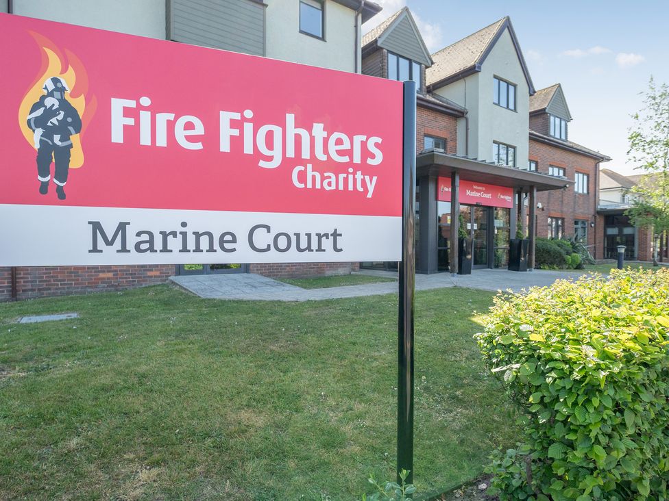 A sign for Fire Fighters Charity at Marine Court in Littlehampton