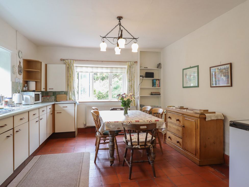 A kitchen with a table and chairs at Hafod, Llangollen