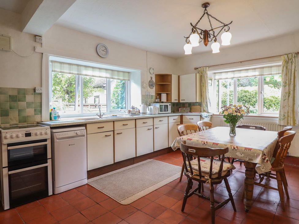 A kitchen with a table and chairs at Hafod in Llangollen