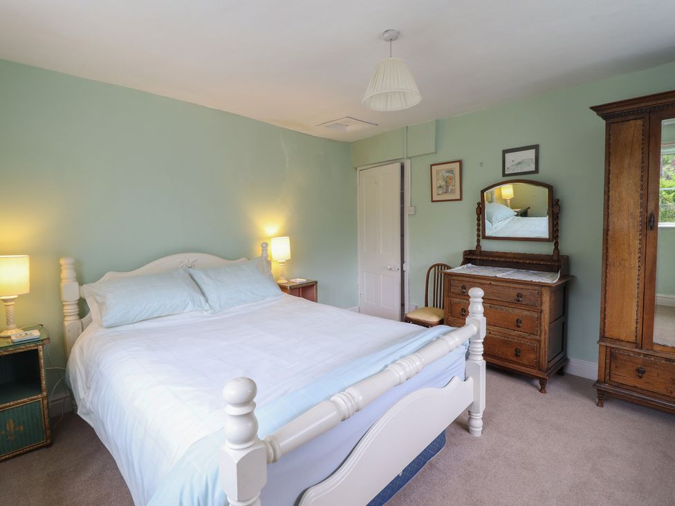 A bedroom with a bed and furniture at Hafod in Llangollen