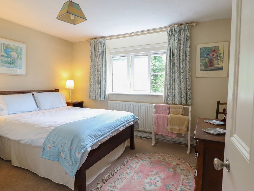 A bedroom with a bed and window at Hafod in Llangollen