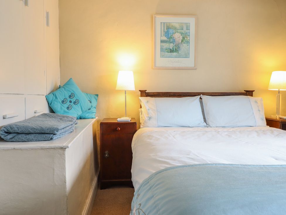A bedroom with a bed and bedside table at Hafod in Llangollen