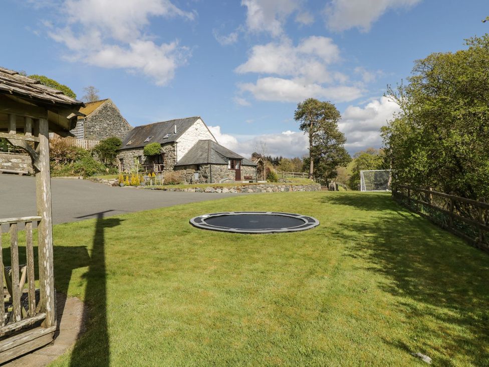 An outdoor area with a trampoline and goalpost at Cyffdy Cottage - Tegid in Bala