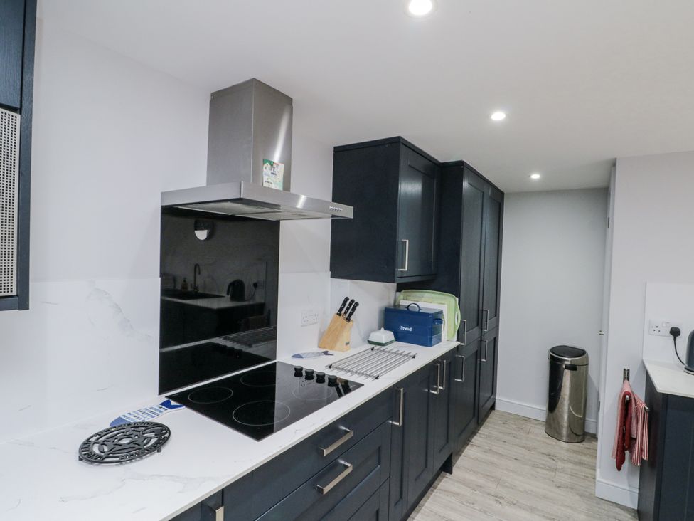A kitchen with a stove and cabinets at Shelstone in Whitby
