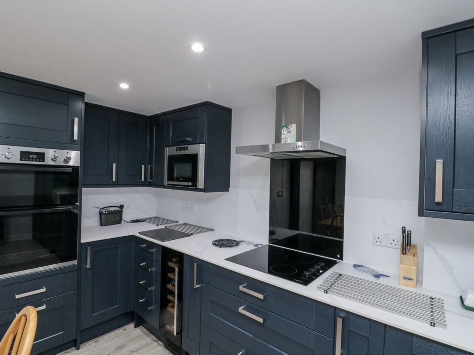 A kitchen with appliances and cabinetry at Shelstone in Whitby