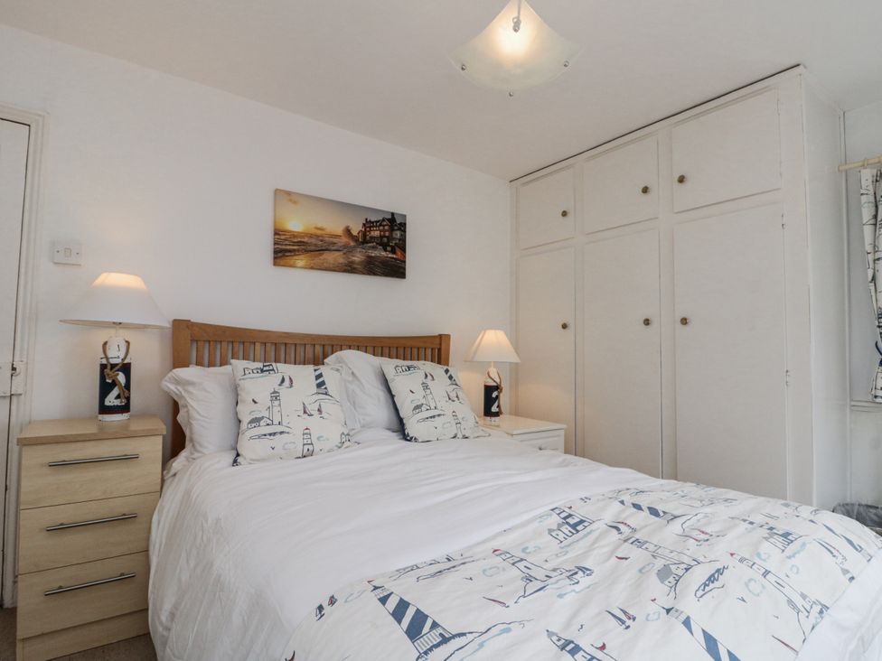 A bedroom with a bed and wardrobe at Shelstone in Whitby