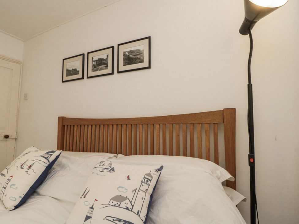 A bedroom with a bed and lamp at Shelstone in Whitby