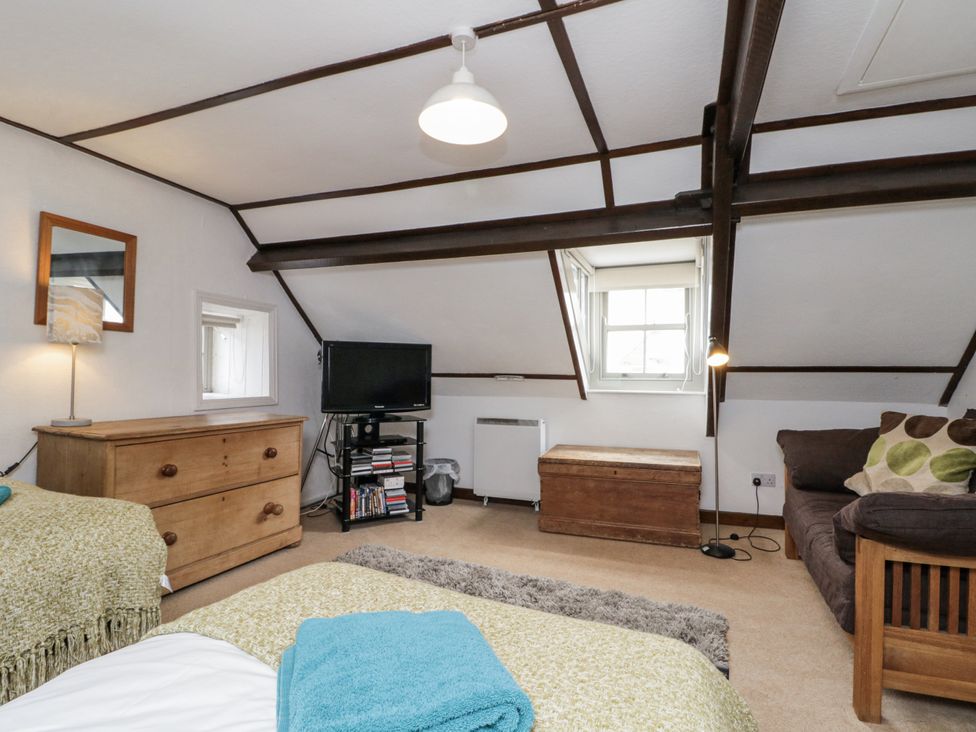 A bedroom with a bed and tv at Shelstone in Whitby