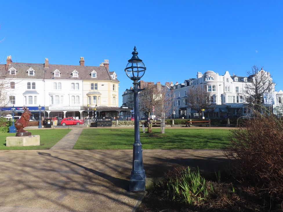 An outdoor scene with buildings and a lamp post at Fox House in Llandudno