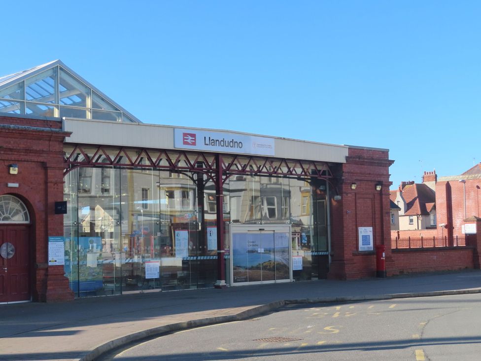 A train station entrance with glass facade in Llandudno