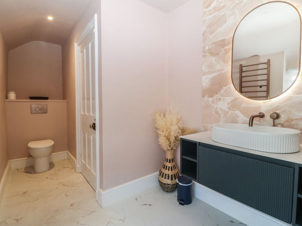 A bathroom with a sink and toilet at Fox House in Llandudno