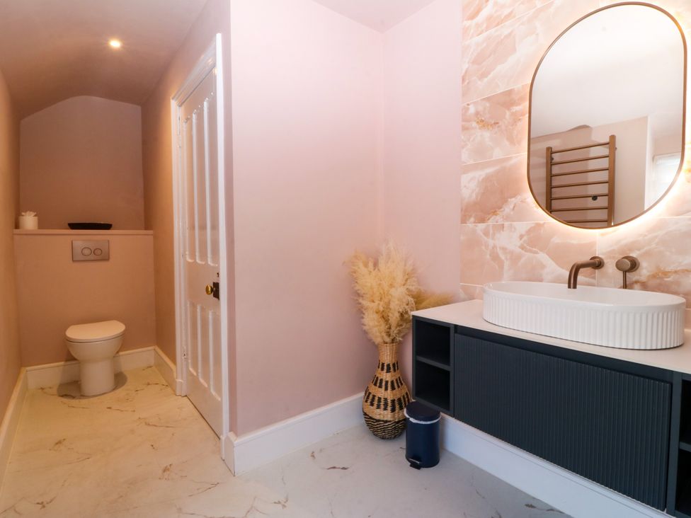A bathroom with a toilet and sink at Fox House in Llandudno