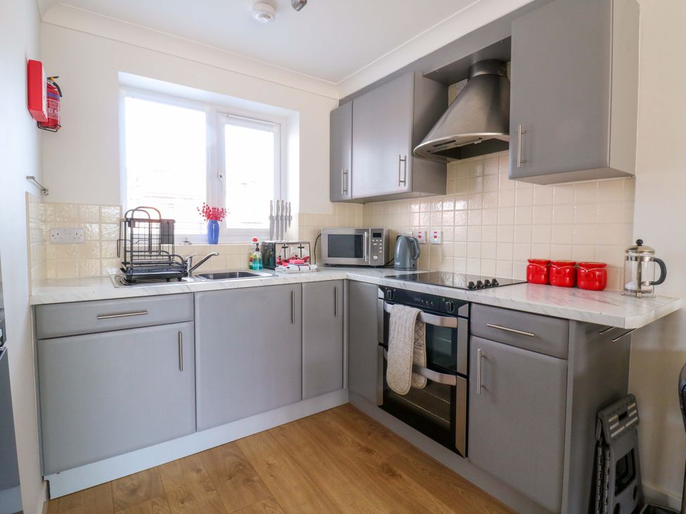 A kitchen with appliances and utensils at Kingsmere Norwich