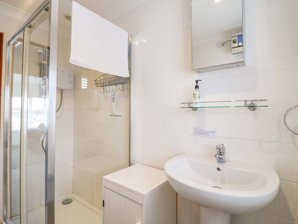 A bathroom with shower and sink at Kingsmere Norwich