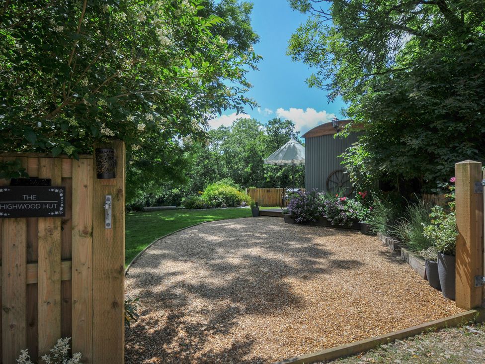 A garden with gravel path and plants at The Highwood Hut near Liskeard