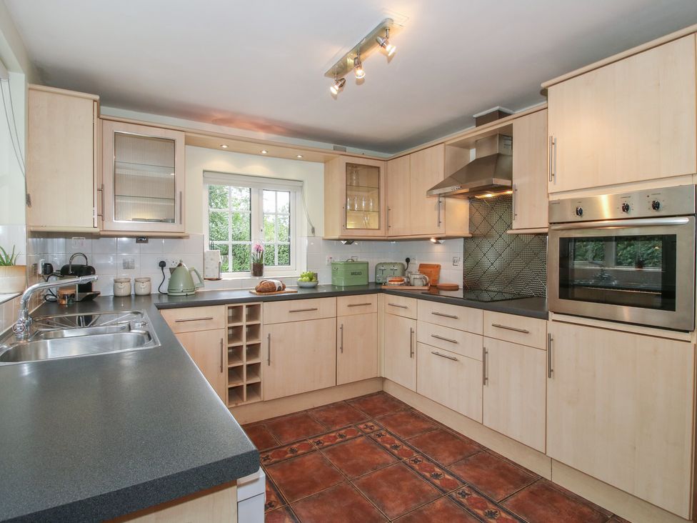 A kitchen with countertop and cabinets at 2 Aqueduct Cottages Chirk Bank near Chirk