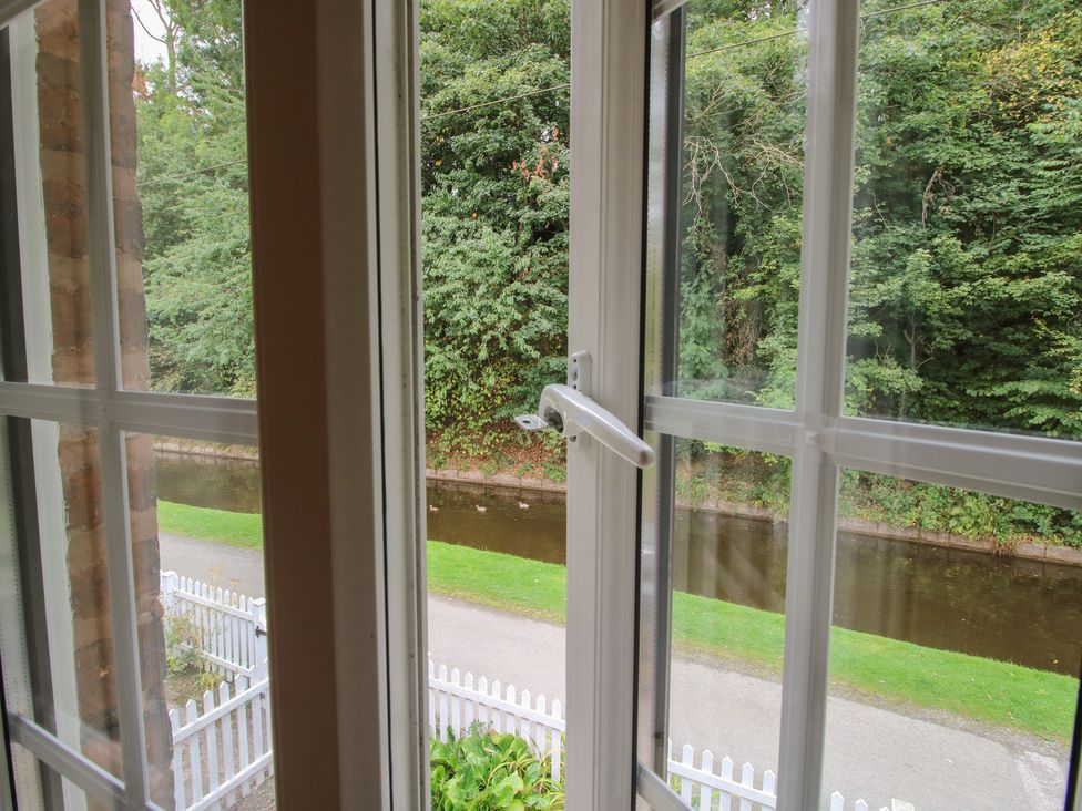 A view from a window showing a canal and trees at 2 Aqueduct Cottages Chirk Bank near Chirk