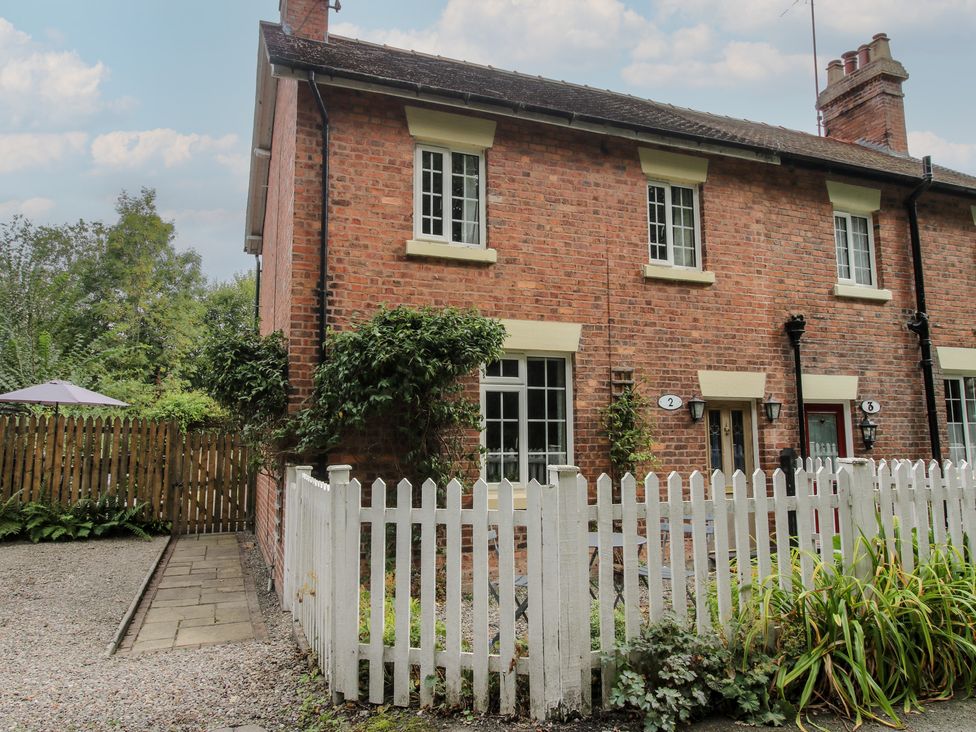 A brick house with windows and garden area at 2 Aqueduct Cottages Chirk Bank near Chirk