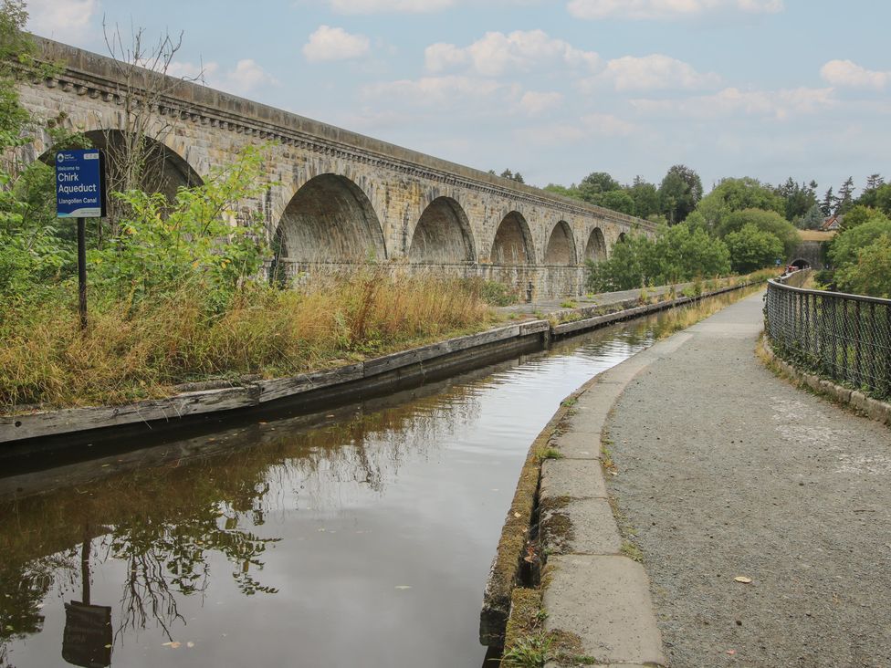 An aqueduct with water and a pathway at 2 Aqueduct Cottages in Chirk Bank near Chirk