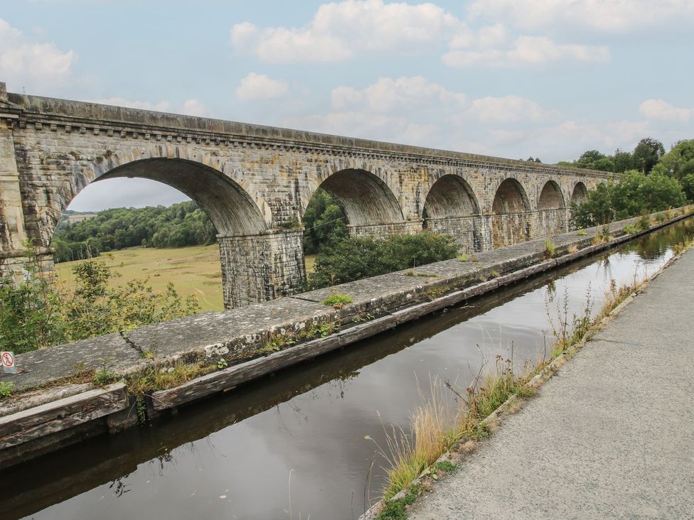 A viaduct with arches over a canal at 2 Aqueduct Cottages in Chirk Bank near Chirk