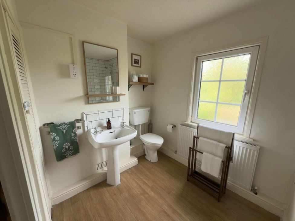 A bathroom with a sink and toilet at 2 Aqueduct Cottages Chirk Bank near Chirk