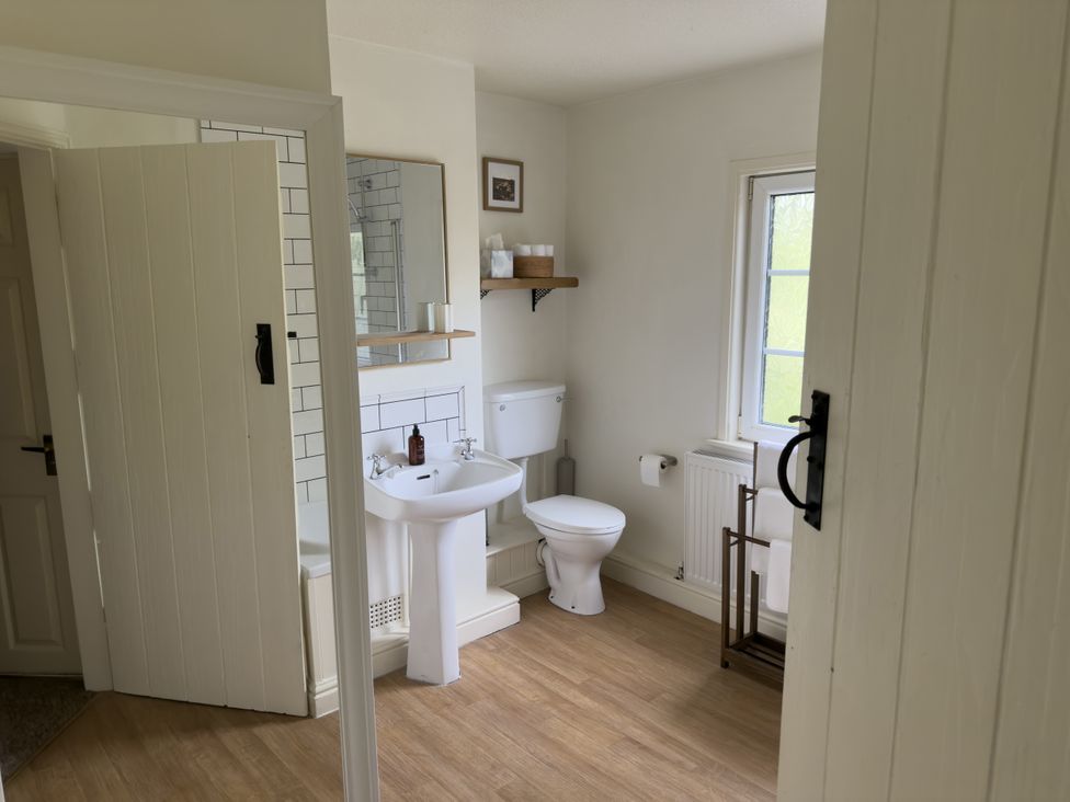 A bathroom with sink and toilet at 2 Aqueduct Cottages Chirk Bank near Chirk