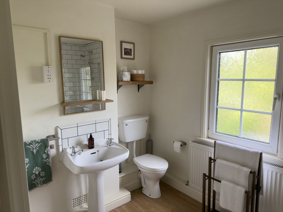 A bathroom with a sink and toilet at 2 Aqueduct Cottages Chirk Bank near Chirk
