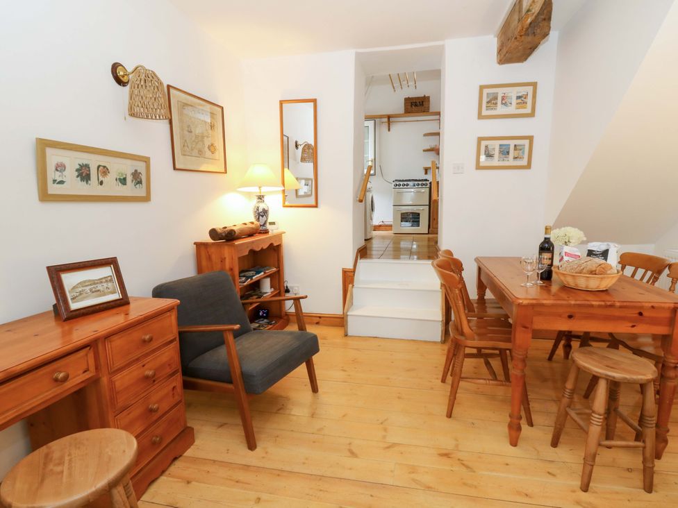A dining room with a table and chairs at No.23 Queen St, Aberystwyth