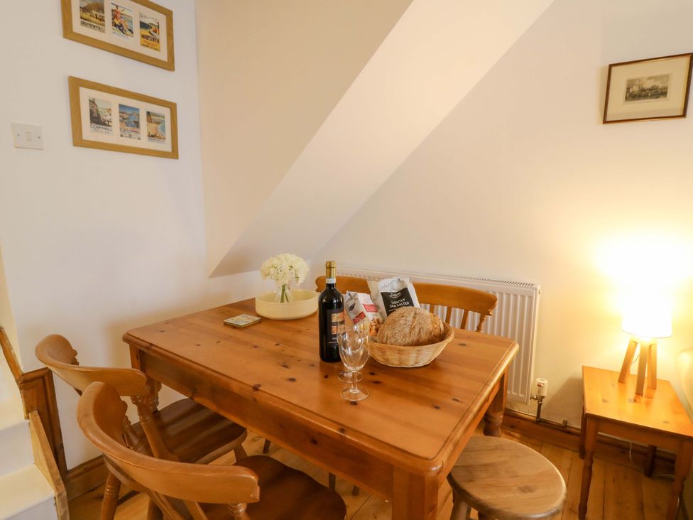 A dining room with a table and chairs at No.23 Queen St Aberystwyth