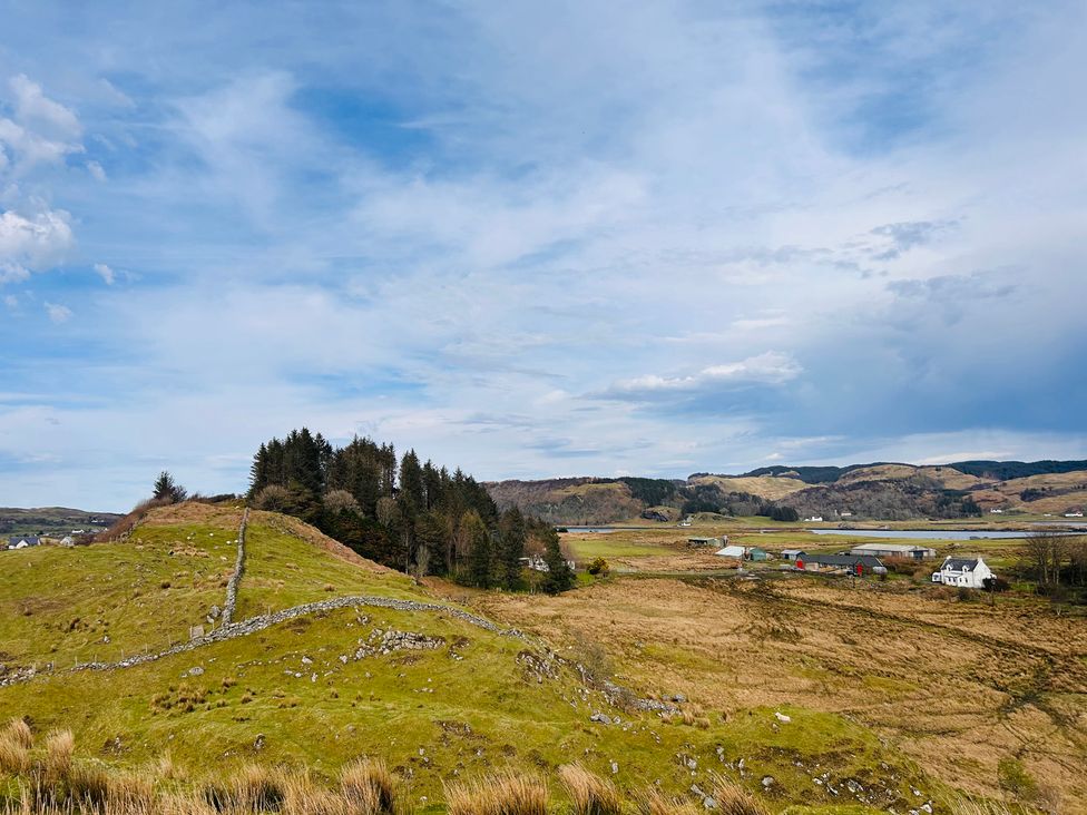 A landscape view with hills and scattered houses at Bathach Beag in Balvicar, Isle Of Seil