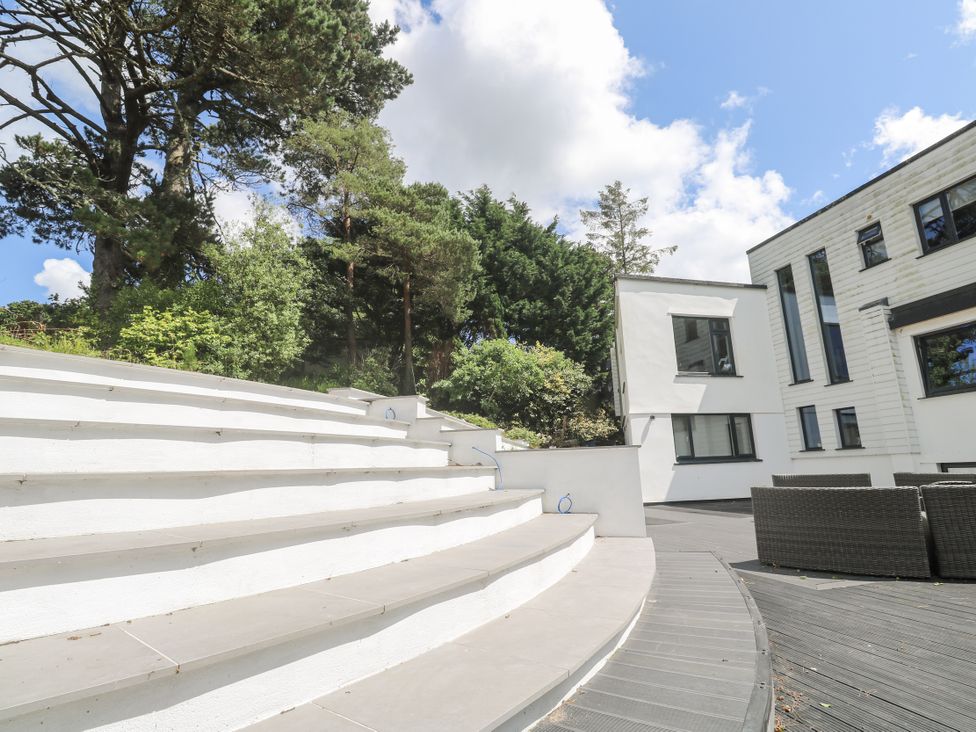 An outdoor area with steps and furniture at Treliance in Truro