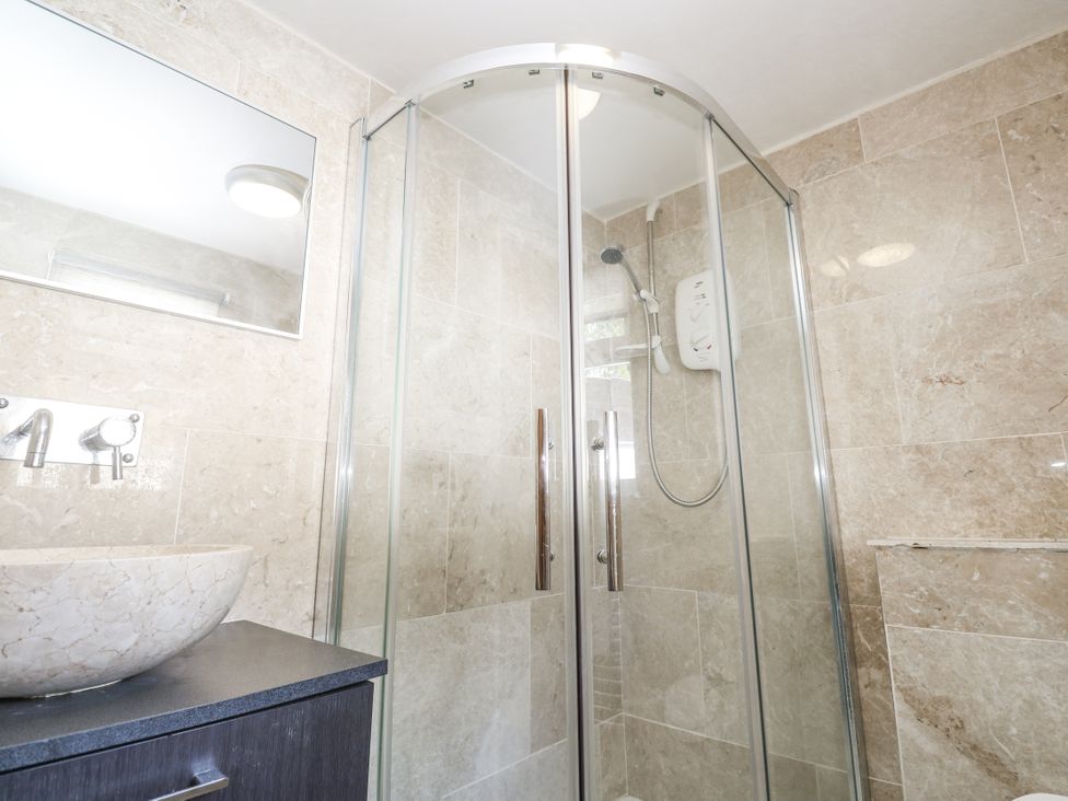 A bathroom with a shower and a sink at Treliance in Truro
