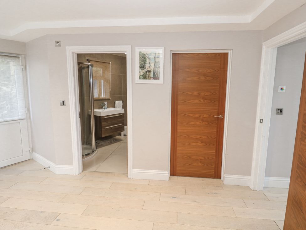 A bathroom with a shower and sink at Treliance in Truro