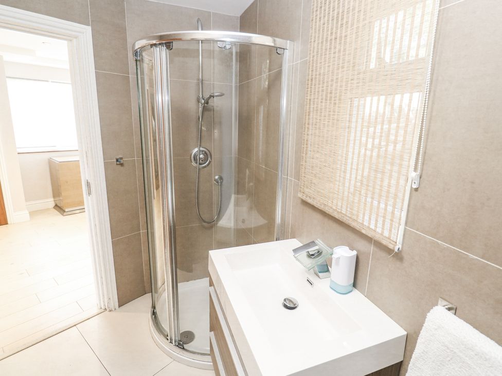 A bathroom with a shower and sink at Treliance in Truro