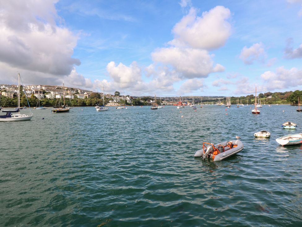 A view of boats on water with houses in the background at Treliance in Truro