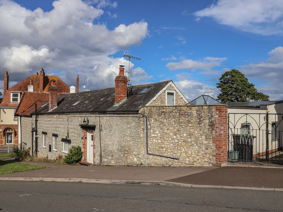 A building with windows and a chimney at The Well House in Lyme Regis