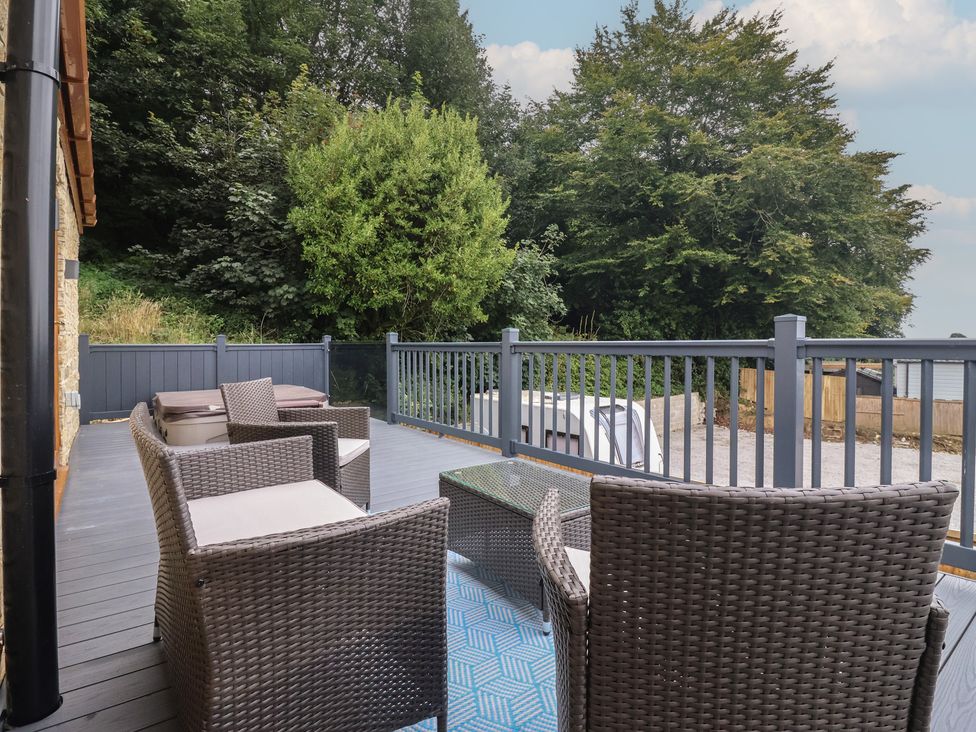 An outdoor seating area with chairs and a table at Castle View in Scarborough