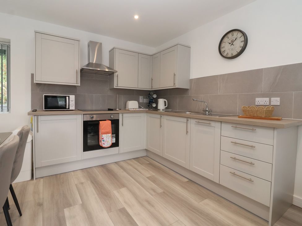 A kitchen with cabinets and appliances at Woodside in Scarborough