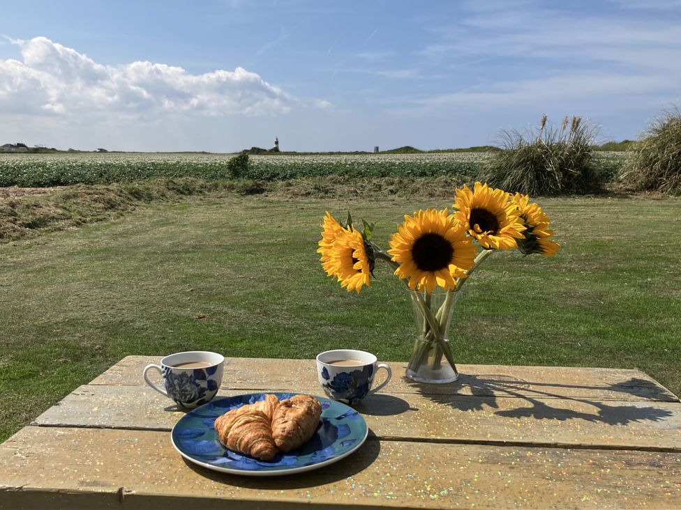 A table set with croissant and cups at Seadrift near Stalham