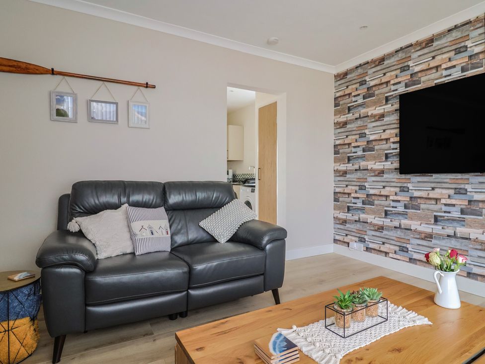A living room with a sofa and coffee table at 7 Cedar Drive Preston