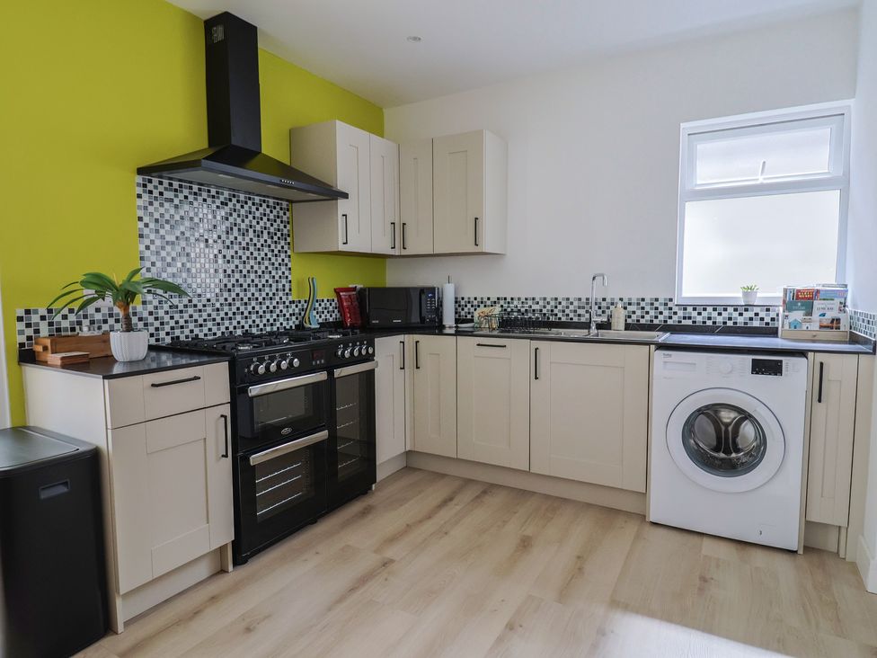 A kitchen with appliances and cabinets at 7 Cedar Drive Preston