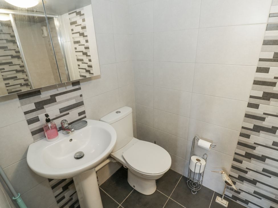A bathroom with a sink and toilet at The Lodge 