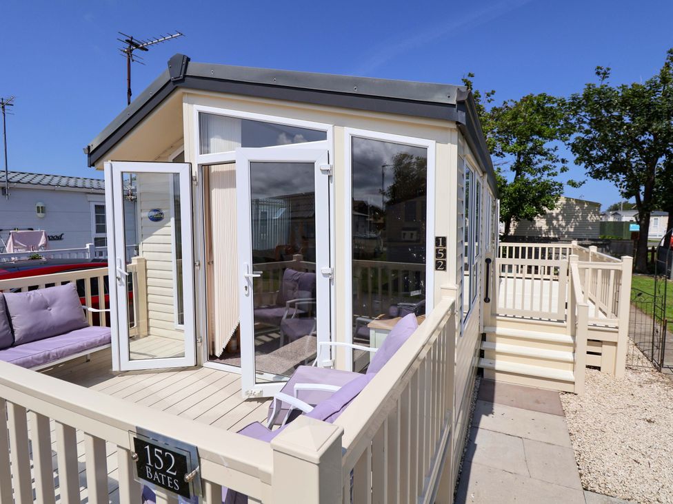 An outdoor deck with seating at 152 Central Park in Prestatyn