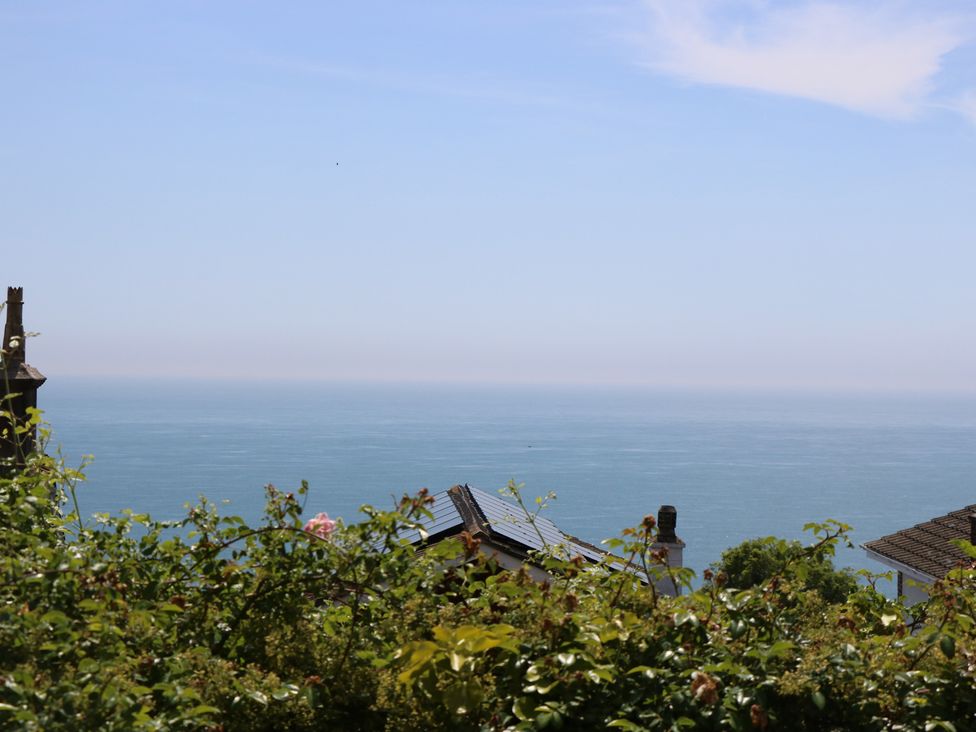 A view of the ocean and rooftops at Poppy Cottage in Ventnor
