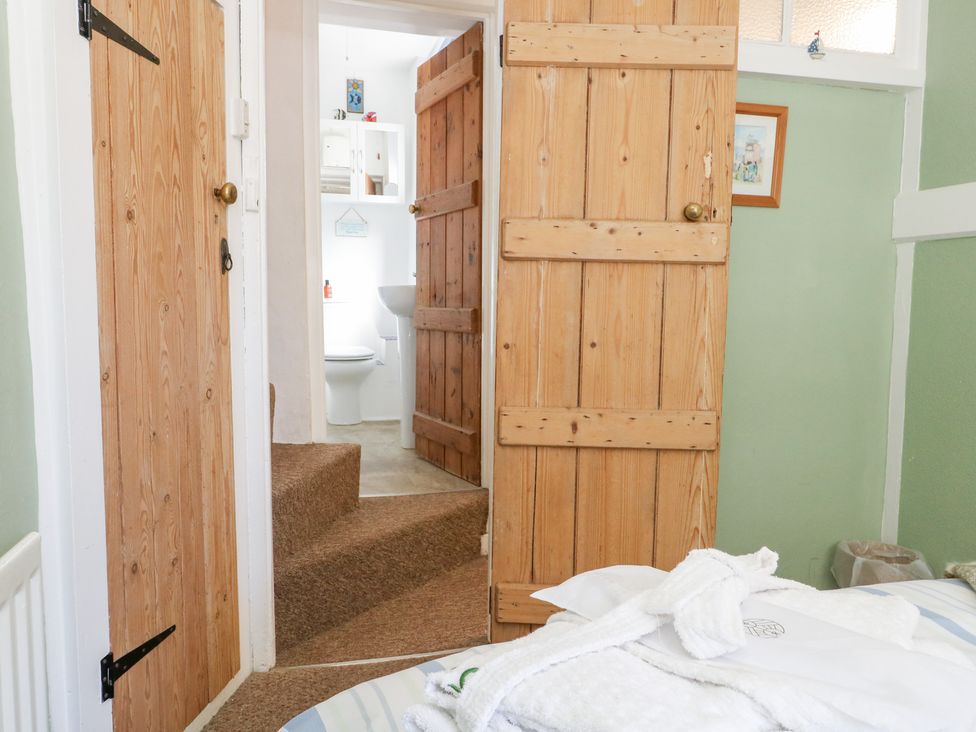 A bathroom with a sink and toilet at Driftwood in Weymouth